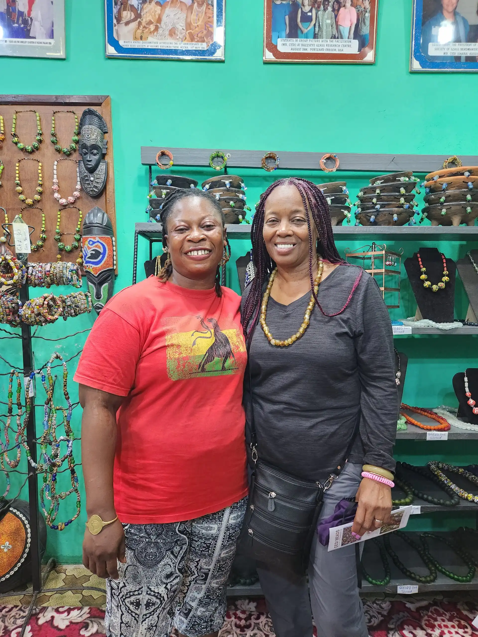 Two women smiling in shop